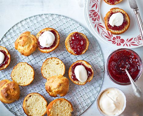 A wire rack serving ice cream scones with jam
